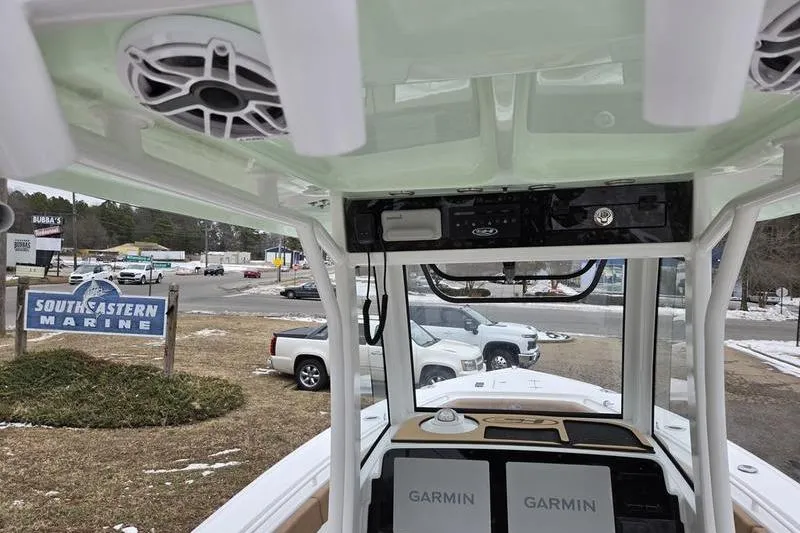 Slide: The Image of 2026 Sea Hunt Ultra 275 SE boat interior with Garmin electronics at Southeastern Marine dealership. - 13