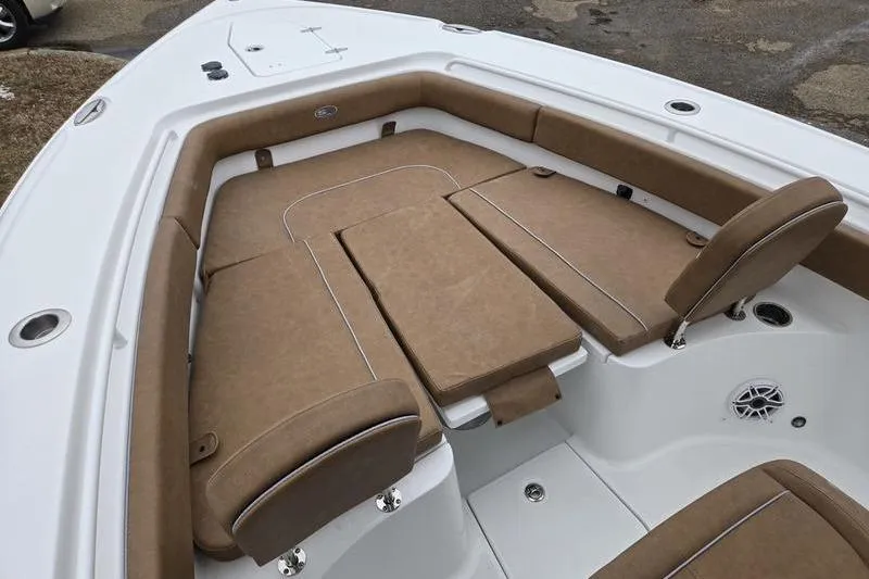 Slide: The Image of 2026 Sea Hunt Ultra 275 SE boat with tan cushioned seating area. - 2