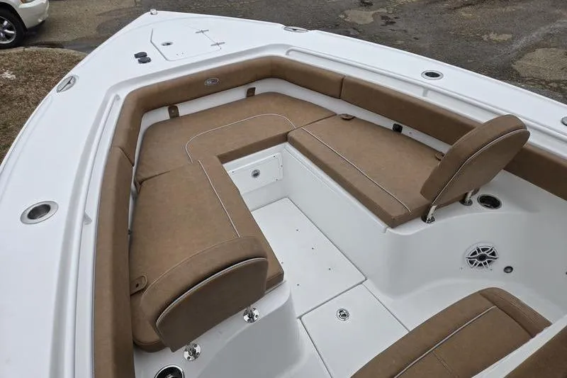 Slide: The Image of 2026 Sea Hunt Ultra 275 SE boat interior with tan cushioned seating. - 4
