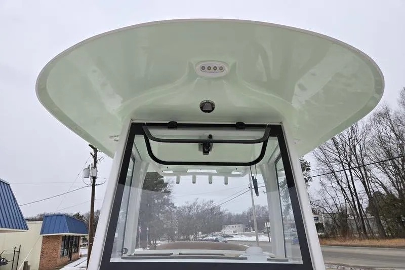 Slide: The Image of 2026 Sea Hunt Ultra 275 SE boat, featuring a sleek T-top design and modern windshield. - 5