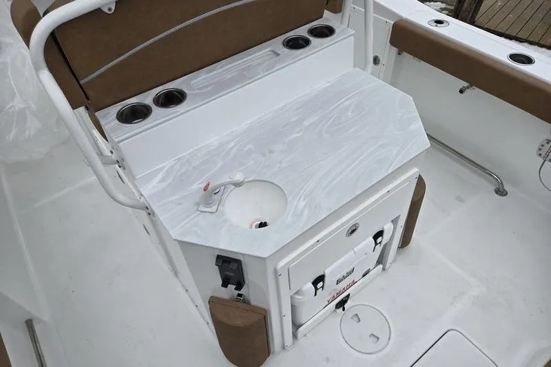 Slide: The Image of Interior of 2026 Sea Hunt Ultra 275 SE boat with seating and storage features. - 7