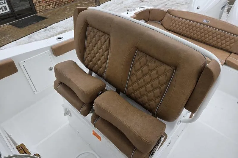 Slide: The Image of Luxurious brown seating on 2026 Sea Hunt Ultra 275 SE boat, featuring diamond stitching. - 8