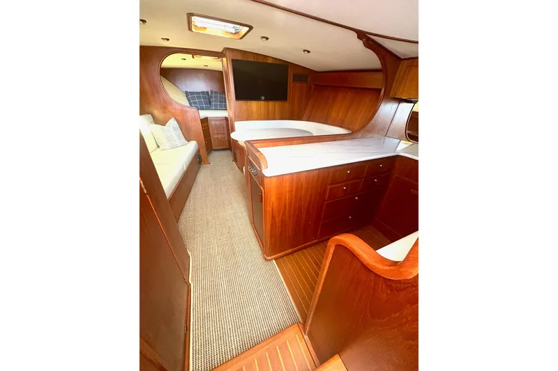 Slide: The Image of Interior of 1991 Garlington 44 Express yacht with wood finish and modern amenities. - 15
