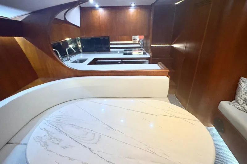 Slide: The Image of Luxurious interior of 1991 Garlington 44 Express yacht with elegant wood finishes. - 19