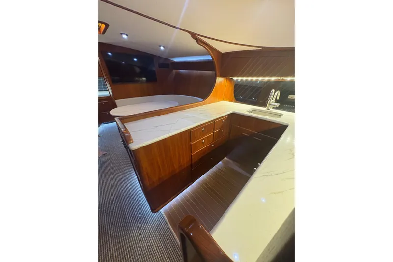 Slide: The Image of Luxurious interior of 1991 Garlington 44 Express yacht with elegant wood and marble finishes. - 20