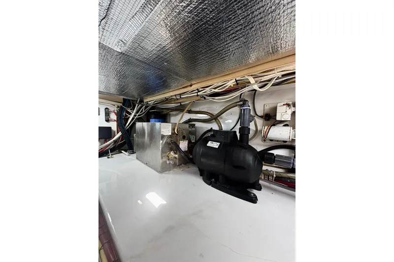 Slide: The Image of Engine room of 1991 Garlington 44 Express with equipment and wiring. - 31