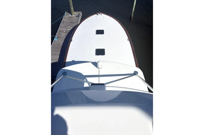 Slide: The Image of Overhead view of 1991 Garlington 44 Express boat docked at a pier. - 4