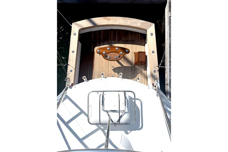 Slide: The Image of Overhead view of 1991 Garlington 44 Express yacht deck with wooden flooring. - 5