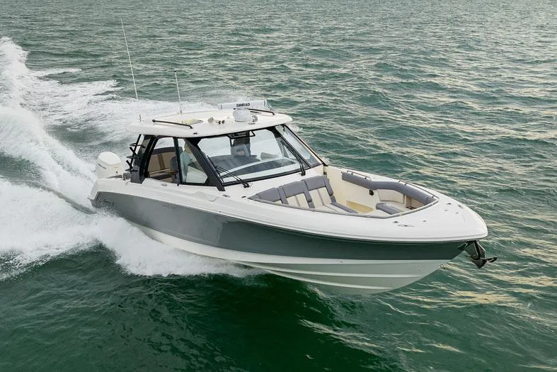 Slide: The Image of Manufacturer Provided Image: 2026 Boston Whaler 380 Realm cruising on open water, showcasing sleek design and performance. - 1