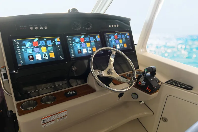 Slide: The Image of Manufacturer Provided Image: 2026 Boston Whaler 380 Realm helm with advanced navigation displays and controls. - 6