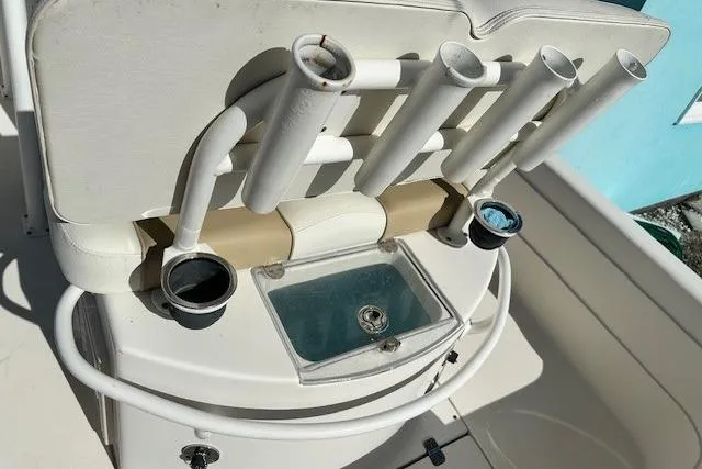 Slide: The Image of 2014 ShearWater 25 LTD boat with rod holders and a small sink. - 22