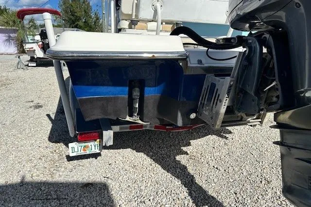 Slide: The Image of Rear view of a 2014 ShearWater 25 LTD boat on a trailer, parked on gravel. - 8
