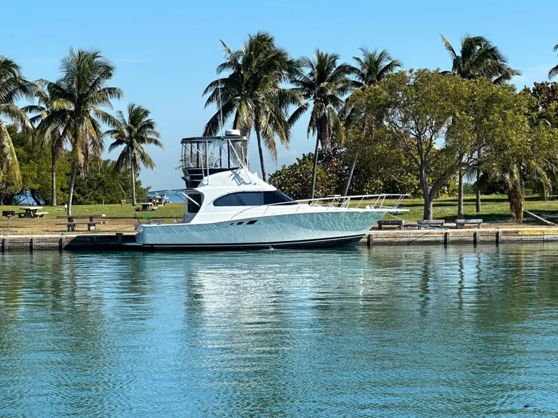 The Image of 1995 Luhrs Tournament 350 yacht docked with palm trees in background. - 0