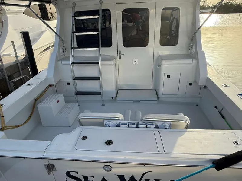 Slide: The Image of 1995 Luhrs Tournament 350 boat rear at dock. - 17