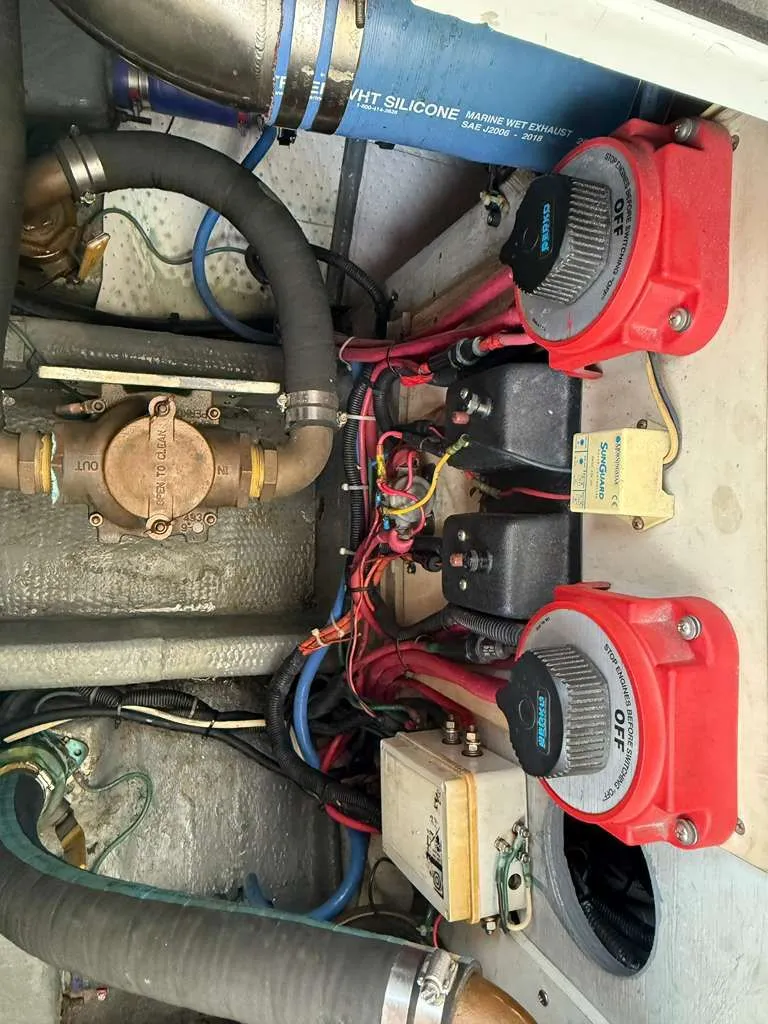 Slide: The Image of 1995 Luhrs Tournament 350 engine room with hoses and valves. - 21