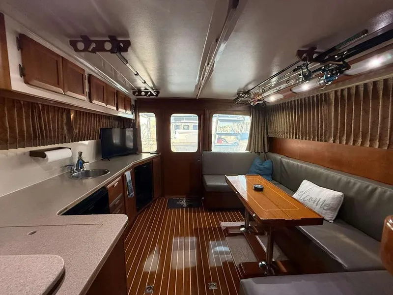 Slide: The Image of Interior of 1995 Luhrs Tournament 350 yacht with cozy seating area. - 3