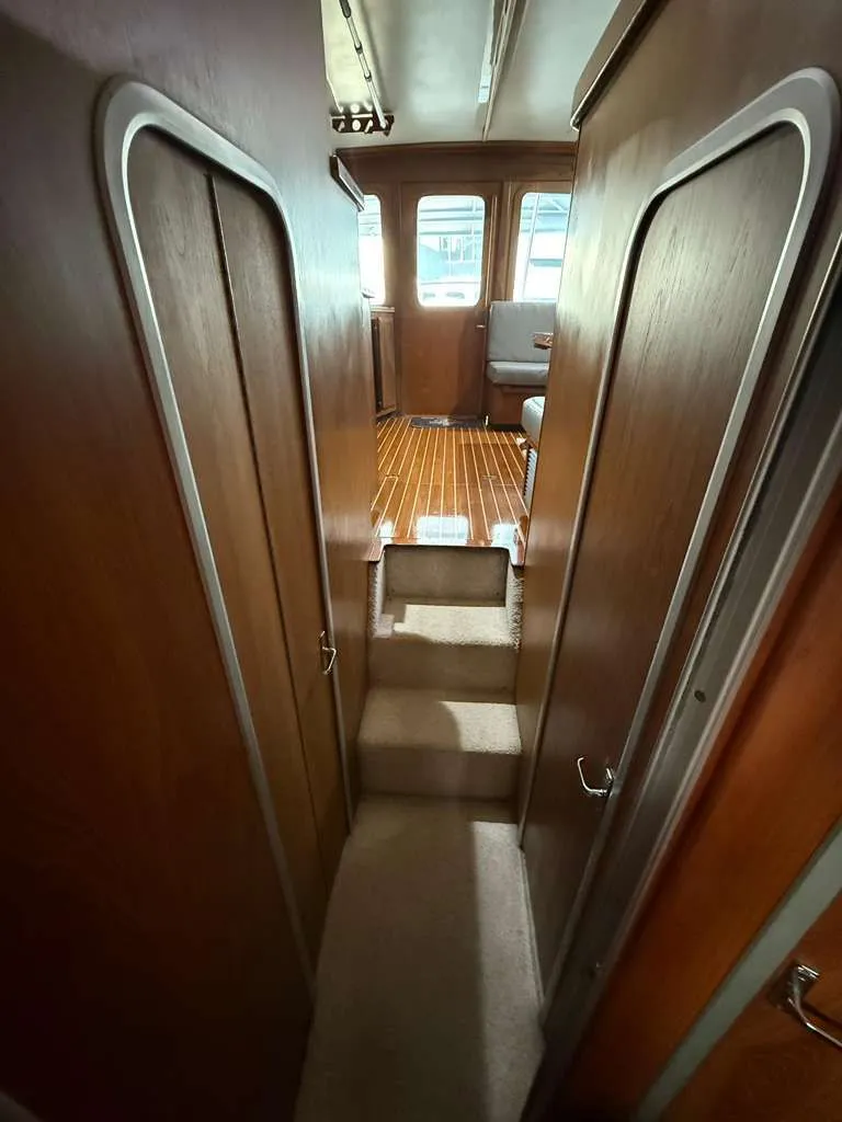 Slide: The Image of 1995 Luhrs Tournament 350 yacht interior with wooden flooring. - 6