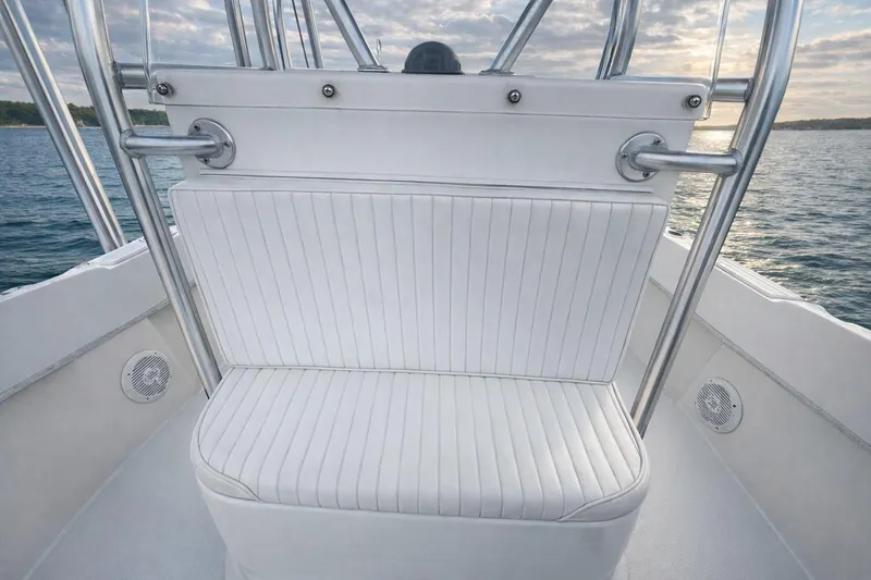 Slide: The Image of Bow view of 2017 Dusky 252 boat with cushioned seating and rod holders. - 14