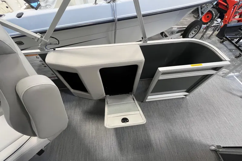 Slide: The Image of 2026 Godfrey Sweetwater 2086 CP boat interior with open storage compartment. - 10