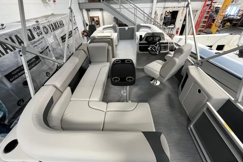 Slide: The Image of 2026 Godfrey Sweetwater 2086 CP pontoon boat interior with plush seating and modern helm. - 14