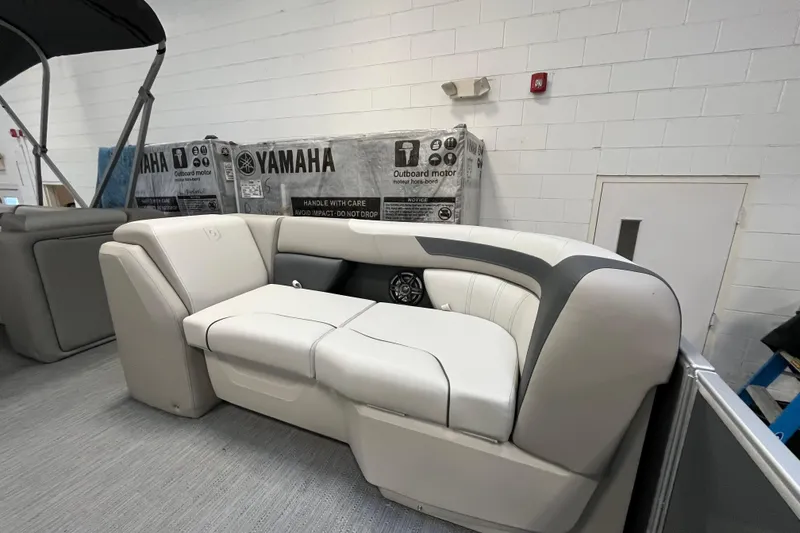 Slide: The Image of 2026 Godfrey Sweetwater 2086 CP boat interior with Yamaha outboard motor packaging. - 17