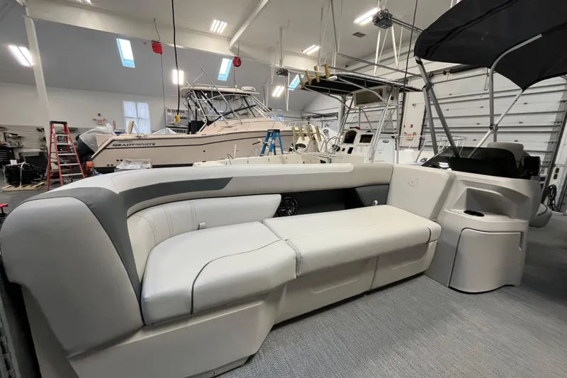 Slide: The Image of 2026 Godfrey Sweetwater 2086 CP pontoon boat interior in a showroom. - 18