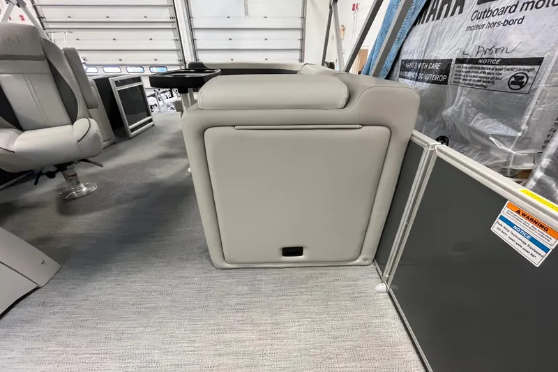 Slide: The Image of 2026 Godfrey Sweetwater 2086 CP interior with gray seating and storage compartment. - 20