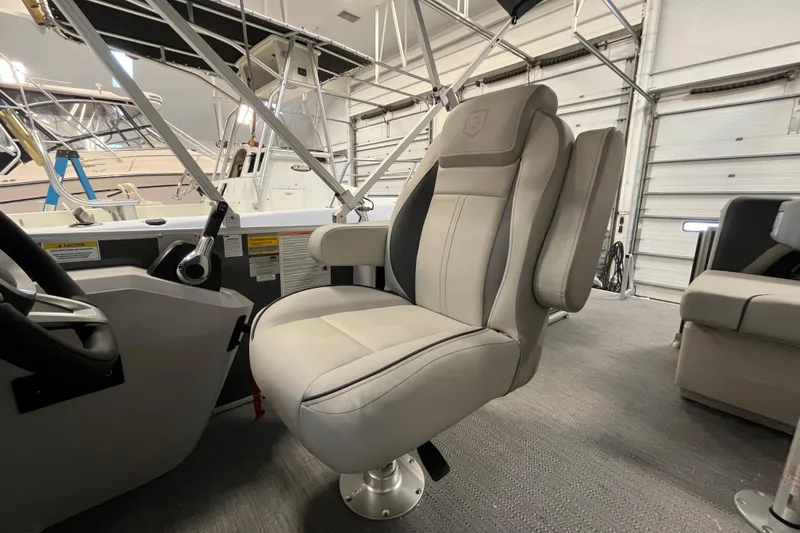 Slide: The Image of Captain's chair on 2026 Godfrey Sweetwater 2086 CP pontoon boat, showcasing luxury seating. - 24