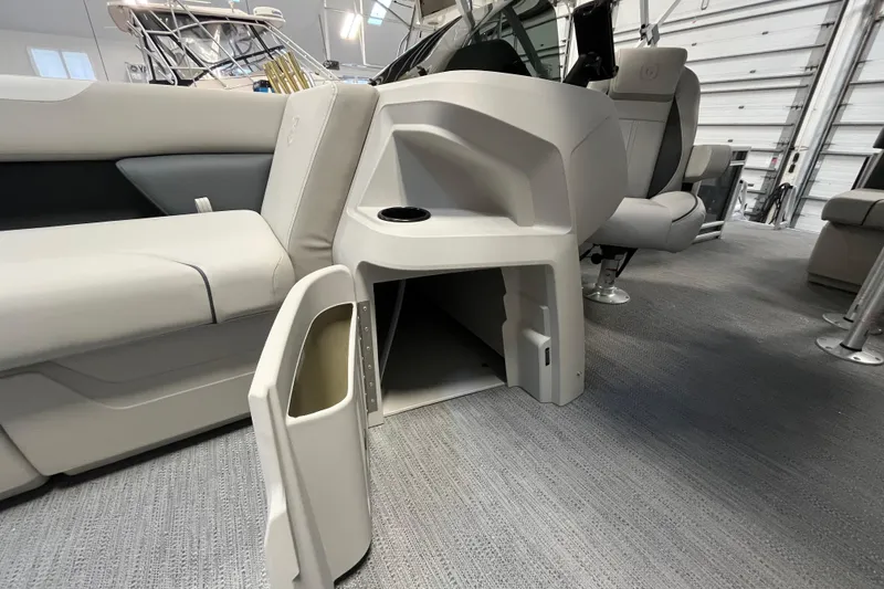 Slide: The Image of 2026 Godfrey Sweetwater 2086 CP interior with open storage compartment and seating. - 28
