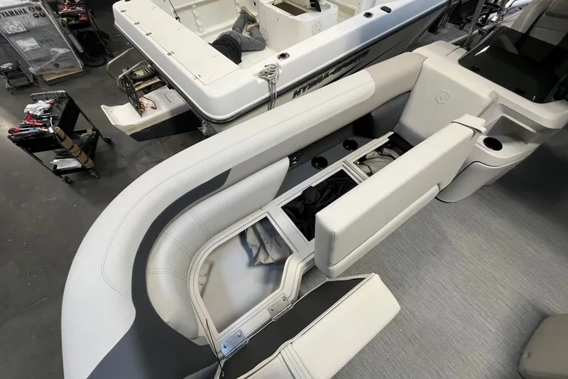 Slide: The Image of 2026 Godfrey Sweetwater 2086 CP boat interior with open storage compartments and seating. - 30