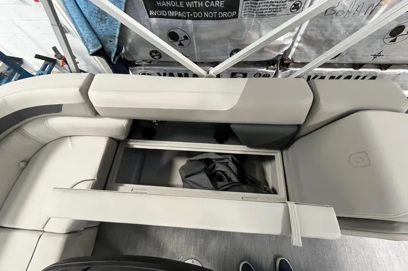 Slide: The Image of 2026 Godfrey Sweetwater 2086 CP boat interior with open storage compartment. - 31