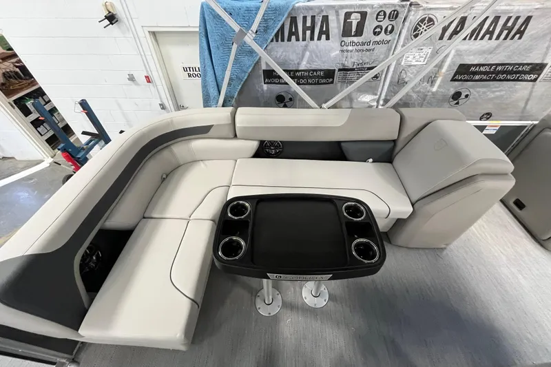 Slide: The Image of 2026 Godfrey Sweetwater 2086 CP boat interior with plush seating and table. - 8