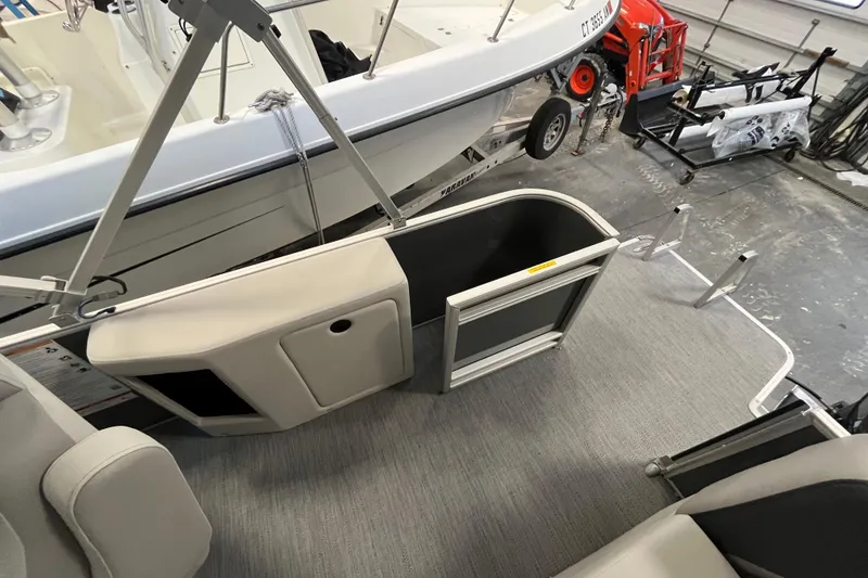 Slide: The Image of 2026 Godfrey Sweetwater 2086 CP pontoon boat interior with open gate and seating. - 9