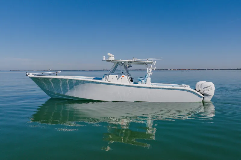 The Image of 2015 Yellowfin 39 Offshore boat on calm water under clear blue sky. - 1