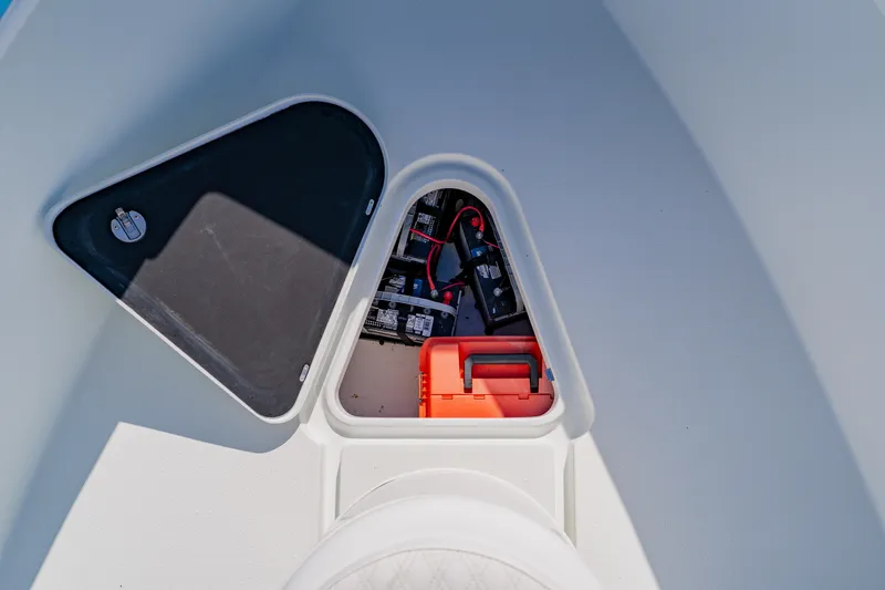 Slide: The Image of 2015 Yellowfin 39 Offshore boat storage compartment with battery and equipment. - 11