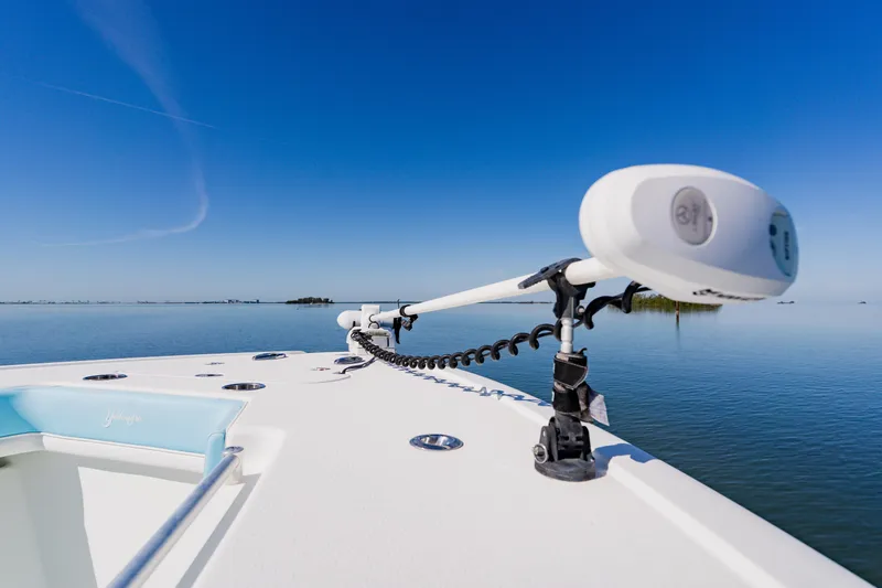 Slide: The Image of 2015 Yellowfin 39 Offshore boat on calm water under clear blue sky. - 14