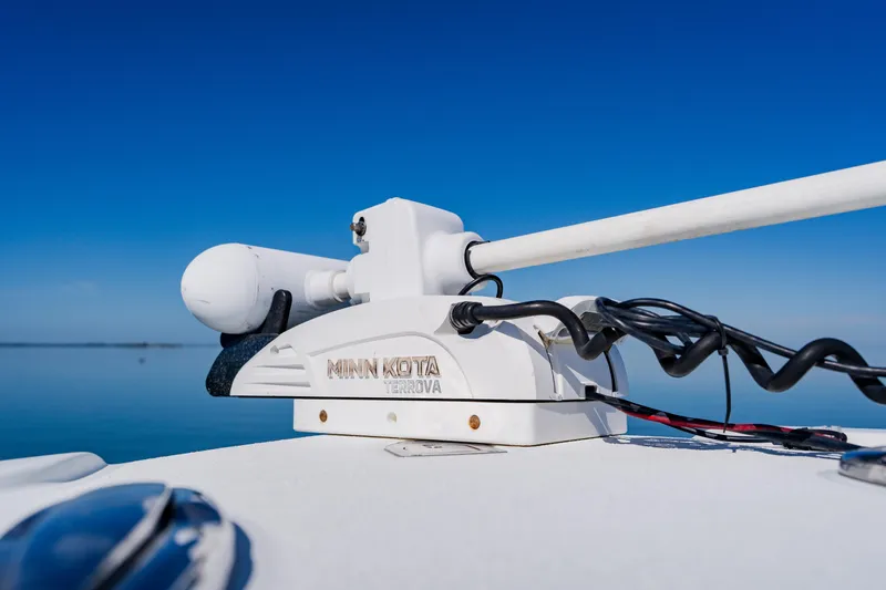 Slide: The Image of Minn Kota Terrova motor on 2015 Yellowfin 39 Offshore boat under clear blue sky. - 15