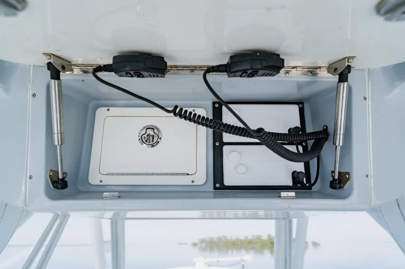 Slide: The Image of 2015 Yellowfin 39 Offshore boat console with storage and electronic equipment. - 21