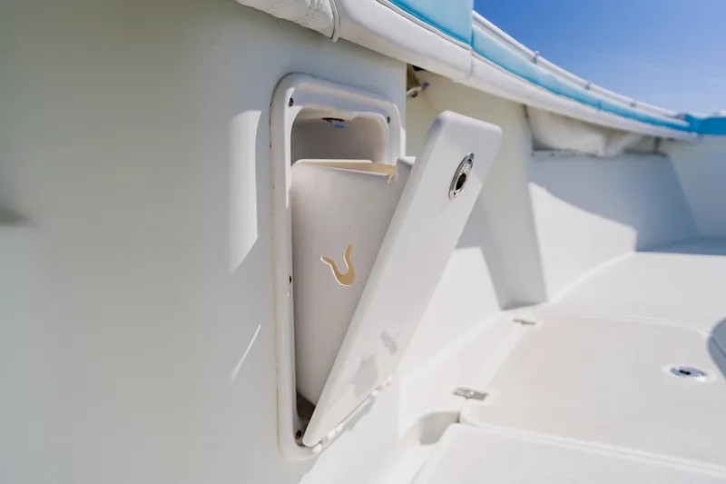 Slide: The Image of 2015 Yellowfin 39 Offshore boat compartment with open hatch, showcasing interior storage. - 25