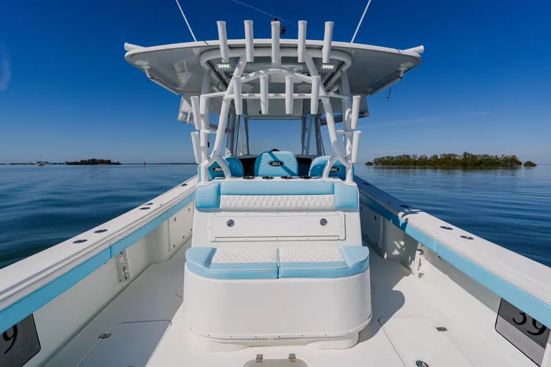Slide: The Image of 2015 Yellowfin 39 Offshore boat on calm water, featuring sleek design and spacious deck. - 28