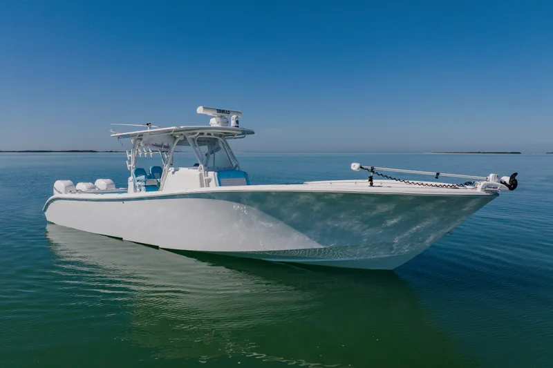 Slide: The Image of 2015 Yellowfin 39 Offshore boat on calm water under clear blue sky. - 3