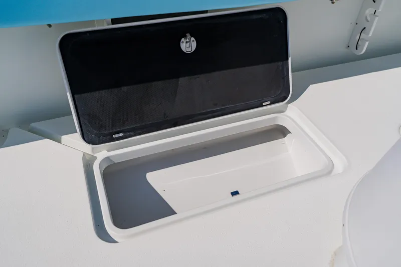 Slide: The Image of Open storage compartment on 2015 Yellowfin 39 Offshore boat deck. - 34