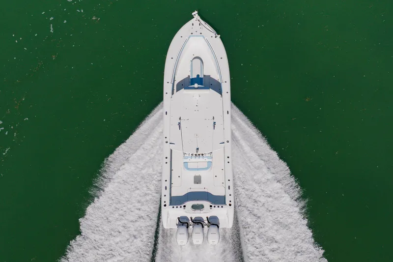 Slide: The Image of Aerial view of 2015 Yellowfin 39 Offshore boat cruising on green water. - 6