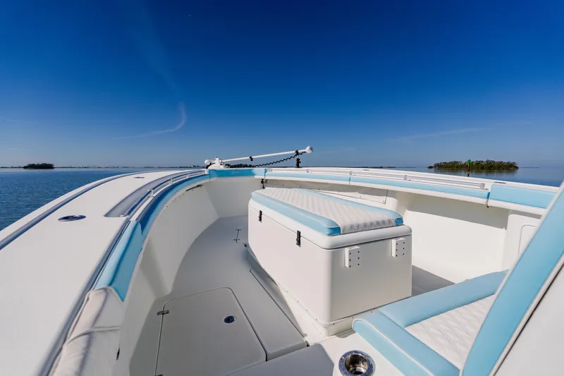 Slide: The Image of 2015 Yellowfin 39 Offshore boat on calm water under clear blue sky. - 8