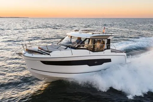 The Image of Manufacturer Provided Image: 2025 Jeanneau NC 895 Series 2 cruising on the ocean at sunset. - 0