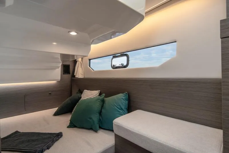 Slide: The Image of Manufacturer Provided Image: 2025 Jeanneau NC 895 Series 2 cabin interior with modern design and comfortable seating. - 10