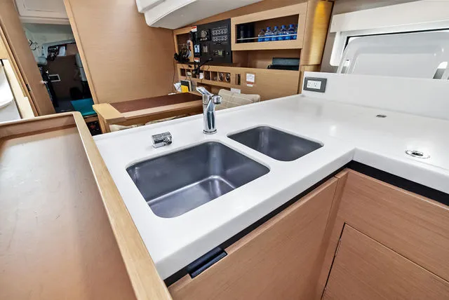 Slide: The Image of Control panel of 2025 Jeanneau NC 895 Series 2 boat with generator and aircon switches. - 28