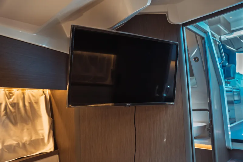 Slide: The Image of Flat-screen TV in the cabin of a 2025 Jeanneau NC 895 Series 2 boat. - 41