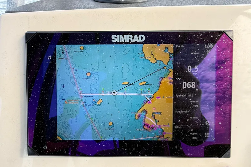 Slide: The Image of Simrad navigation display on 2024 Boston Whaler 210 Montauk boat, showing nautical chart. - 25