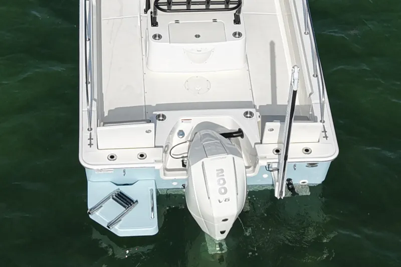 Slide: The Image of 2024 Boston Whaler 210 Montauk boat with outboard motor on water. - 6